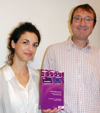 Two people (Asimina Michailidou and Hans-Jörg Trenz) holding a book.