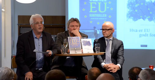 Three men at a stage during an academic debate: Eriksen, Ask and Helgesen
