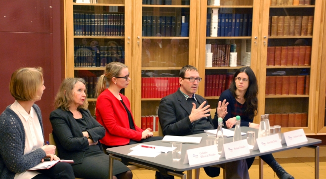 Five people having a panel debate.