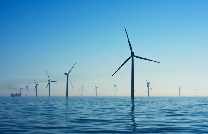 photo of electric windmills in the sea