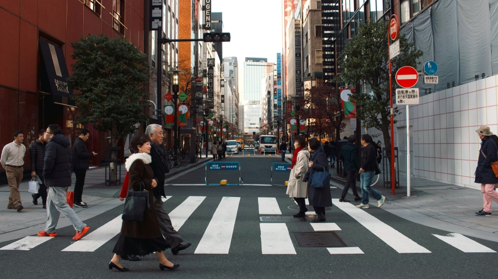 People crossing the street in a big city