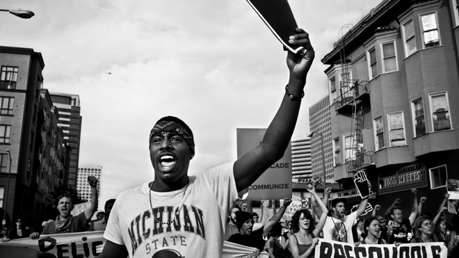 Black and white photo of a man during the Occupy Wall Street protet movement.